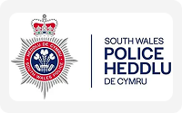 South Wales Police badge with crown and Welsh emblem